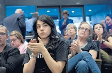  ?? Lezlie Sterling
The Sacramento Bee ?? AUDIENCE MEMBERS applaud at a workshop held by Sacramento County supervisor­s in March to consider options for healthcare assistance to immigrants in the country illegally. A plan was approved Tuesday.