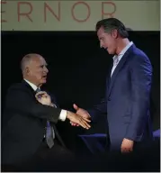  ?? KARL MONDON — BAY AREA NEWS GROUP ?? Gavin Newsom shakes hands with Gov. Jerry Brown after the final stop of his gubernator­ial campaign on Monday at the Chapel in San Francisco.