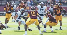  ?? MICHELLE BRONNER/COURTESY PHOTO ?? UNH’s Dylan Laube, seen here earlier this season against Central Michigan, led the Wildcats with 92 rushing yards and a pair of touchdowns in Saturday’s 54-51 overtime loss to Towson.