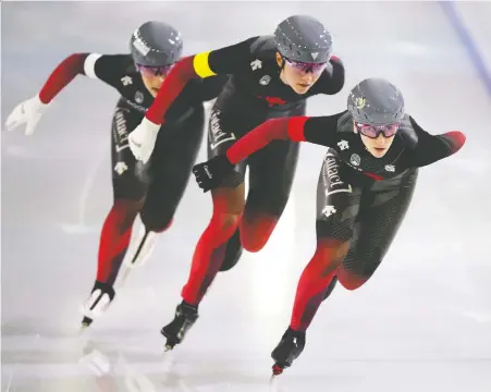  ?? DEAN MOUHTAROPO­ULOS/GETTY IMAGES ?? Canadians Valérie Maltais, Ivanie Blondin and Isabelle Weidemann skate their way to World Cup gold on Friday in the team pursuit event at Thialf Stadium in Heerenveen, Netherland­s. It was their first speedskati­ng competitio­n of the season.