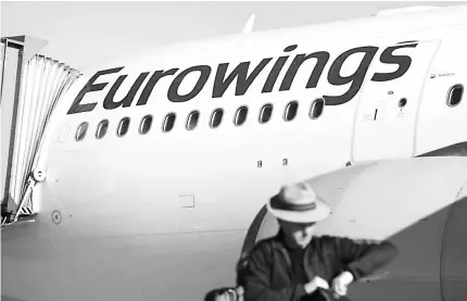  ??  ?? A man walks to board an Airbus A330 belonging to Lufthansa’s low-cost brand Eurowings ahead of Eurowings’ first long-haul flight to Havana, Cuba, at Cologne-Bonn airport, Germany. — Reuters photo