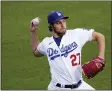  ?? MARK J. TERRILL — THE ASSOCIATED PRESS FILE ?? Los Angeles Dodgers starting pitcher Trevor Bauer warms up prior to a baseball game against the Colorado Rockies, April 13, 2021, in Los Angeles.