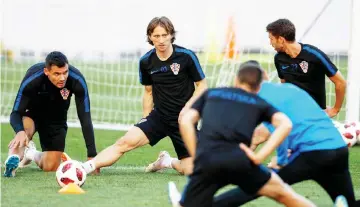  ??  ?? Croatia’s Luka Modric (second left) and teammates attend a training session at the Park Arena in Sochi. — AFP photo