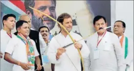  ?? PTI ?? Congress vicepresid­ent Rahul Gandhi after being presented with a bow and arrow during his public meeting at Devghad Bariya village of Dahod district on Wednesday.
