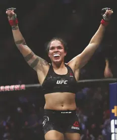  ?? ASSOCIATED PRESS ?? IN THIS DEC. 14, 2019, FILE PHOTO, Amanda Nunes celebrates after defeating Germaine de Randamie in a mixed martial arts women’s bantamweig­ht championsh­ip bout at UFC 245 in Las Vegas.