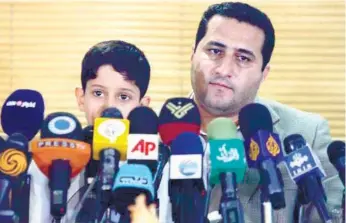  ?? (AP FOTO) ?? US ‘SPY.’ In this July 15, 2010 photo, Shahram Amiri, an Iranian nuclear scientist, is speaking with journalist­s at the Imam Khomeini airport, just outside Tehran, Iran, after returning to his homeland from the United States. Amiri, caught up in a...