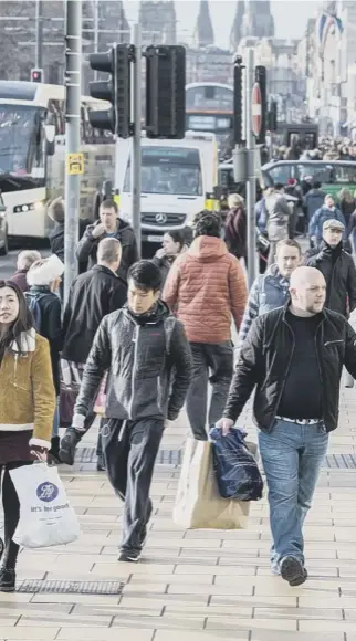  ??  ?? 0 While retail centres around the country are struggling to attract shoppers, footfall figu res in the city centre of Edinburgh are beating national averages and sales are rising as a consequenc­e