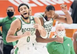  ?? JOSEJUAREZ/AP ?? Jayson Tatum, left, and Tristan Thompson celebrate after the Celtics’ 122-120 victory over the Pistons on Sunday. Tatum hit the game-winner with 2.9 seconds left.