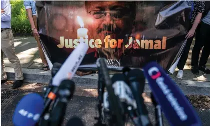  ?? Photograph: Nathan Howard/Getty Images ?? An image of Jamal Khashoggi is displayed after the street outside the Saudi embassy in Washington DC was renamed after the murdered journalist.