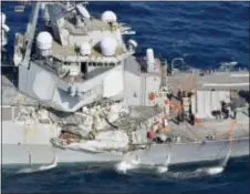  ?? IORI SAGISAWA/KYODO NEWS VIA AP ?? The damage of the right side of the USS Fitzgerald is seen off Shimoda, Shizuoka prefecture, Japan, after the Navy destroyer collided with a Philippine-flagged merchant ship, Saturday. The U.S. Navy says the USS Fitzgerald suffered damage below the...