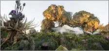  ?? KENT PHILLIPS — DISNEY VIA AP ?? This photo provided by Disney shows a new land opening at Walt Disney World’s Animal Kingdom in Lake Buena Vista, Fla., on called “Pandora - The World of Avatar.” The land was inspired by the lush world of Pandora depicted in the movie “Avatar.”