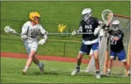  ?? BARRY TAGLIEBER - FOR DIGITAL FIRST MEDIA ?? Pope John Paul II’s Kyle Donovan looks to pass as Phoenixvil­le’s Brendan Jenkins defends Tuesday during a District 1-2A first round game.