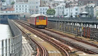  ?? PAUL BIGLAND/ RAIL. ?? A Class 483 crosses Ryde Pier on July 9 2014, Deryk Simpson says the Island Line’s future relies on the continued running of the Portsmouth Harbour station to Ryde Pier Head ferry.
