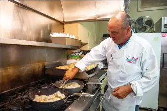  ?? SUBMITTED PHOTO ?? In this September 2019 file photo, Mike Bowman, president and CEO of the Valley Forge Tourism and Convention Board cooks lunch at a Freedom From Hunger Food Drive event. The tourism board on Friday, March 6 released a statement saying it is monitoring the coronaviru­s situations, but remains ready to welcome visitors to Montgomery County.