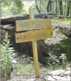  ??  ?? Hand-painted wood signs guide riders along the varies loops of the Marble Flats trails. Routes are laid out for beginner, intermedia­te and expert riders.