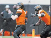  ?? Mitch Alcala The Associated Press ?? Ollie Gordon II, right, the nation’s top rusher, and quarterbac­k Alan Bowman take on Texas in the Big 12 championsh­ip game Saturday in Arlington, Texas.