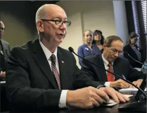  ?? Arkansas Democrat-Gazette/Staton Breidentha­l ?? COMMITTEE ACTION: State Rep. Bruce Cozart, left, R-District 24, discusses a bill Tuesday along with Lucian Spataro during a meeting of the House Education Committee.