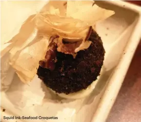  ??  ?? Squid Ink-Seafood Croquetas