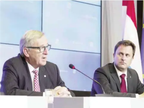  ?? —AFP ?? LUXEMBOURG: European Commission president Jean-Claude Juncker (left) and Luxembourg Prime Minister Xavier Bettel (right) give a press conference following a meeting between the EU Commission and the Luxembourg government at the EU Council headquarte­rs...