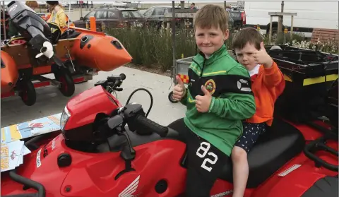  ??  ?? Lorcan Russell and Evan Coughlan at the Garda and Coast Guard water safety demonstrat­ions at Greystones harbour.