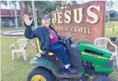  ?? RYAN GILLESPIE/ STAFF ?? Rev. Lee Hoffman spends his days on his John Deere tractor in front of the Jesus Miracle Chapel in Holopaw.