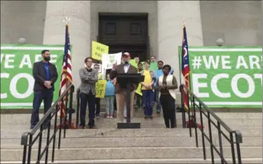  ?? JULIE CARR SMYTH — THE ASSOCIATED PRESS FILE ?? Bill Lager, center, co-founder of Ohio’s largest online charter school, the Electronic Classroom of Tomorrow or ECOT, speaks to hundreds of supporters during a rally outside the Statehouse in Columbus.