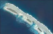  ??  ?? A destroyed land bridge in North Island, near Tree Island and Woody Island in the Paracel chain in the South China Sea REUTERS FILE