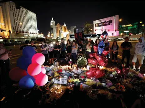  ?? Reuters ?? A makeshift memorial in the middle of Las Vegas Boulevard in tribute to victims of Sunday’s mass shooting in the city