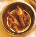  ?? Craig Lee / The Chronicle ?? The chicken from Frisco Fried in San Francisco makes Mimi Sheraton’s list of must-eat foods. Since 1958, family-run dim sum palace Yank Sing has offered an array of mouthwater­ing dishes.