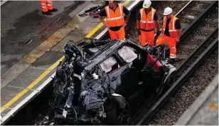  ?? ?? Wreck: The car ended up on the tracks at Park Royal undergroun­d station