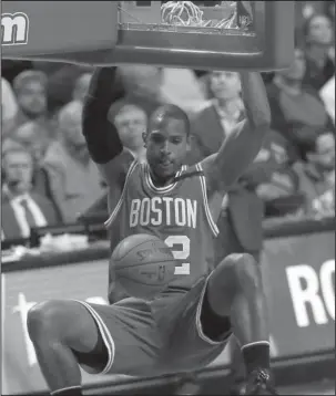  ?? The Associated Press ?? CELTIC PRIDE: Boston center Al Horford dunks against the Chicago Bulls during the second half of an NBA Eastern Conference first-round playoff series Friday night in Chicago. Horford had 18 points and eight rebounds in Boston’s 104-87 win.