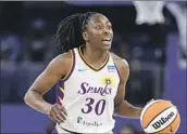  ?? Kamil Krzaczynsk­i Associated Press ?? NNEKA OGWUMIKE, who averaged 18.1 points and 6.6 rebounds last season, signed a one-year deal.