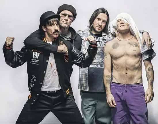  ?? Mariah Tauger Los Angeles Times ?? KEEPING that anythinggo­es spirit alive are Anthony Kiedis, from left, Chad Smith, the returning John Frusciante and Flea of the Red Hot Chili Peppers.