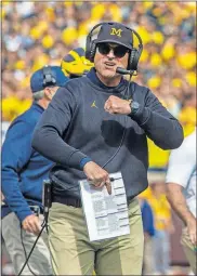  ?? [TONY DING/THE ASSOCIATED PRESS] ?? Michigan coach Jim Harbaugh will lead his team into Happy Valley on Saturday for a key Big Ten matchup with Penn State.