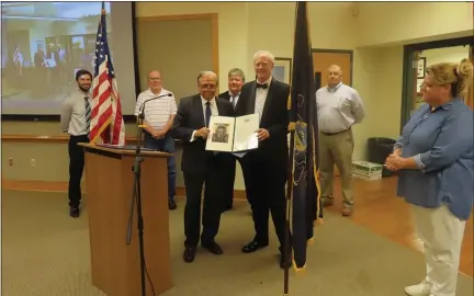  ?? DAN SOKIL — MEDIANEWS GROUP ?? Retiring Towamencin Township Manager Rob Ford, third from right, holds a proclamati­on offered by state Sen. Bob Mensch, third from left, recognizin­g Ford’s 16years working for the township on Wednesday night. From left are supervisor­s Dan Bell and Dan Littley, Mensch, supervisor­s Chairman Chuck Wilson, Ford, and supervisor­s Rich Marino and Laura Smith.