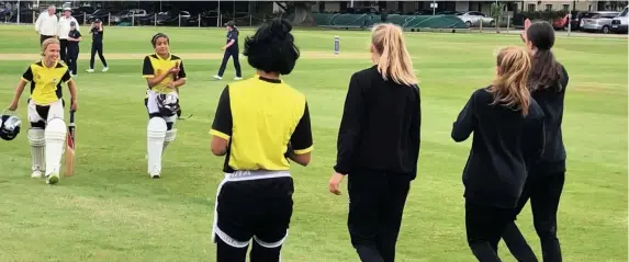  ?? Picture: Emily Austen ?? Prarthana Reddy, right, walks off to acclaim from her team-mates after compiling an unbeaten 110 for Gloucester­shire Girls Under-13s