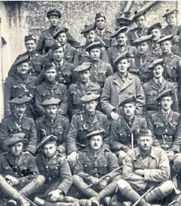  ??  ?? OFF TO WAR: Black Watch soldiers prepare to leave Dundee Station for deployment in the First World War, left, and Major Ian Watson Wardlaw Shepherd is pictured second row from the front, second from right, above.