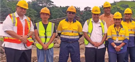  ?? ?? Minister for Lands and Mineral Resources Jone Usamate (third from left) with some of the team at Gold Rock Investment­s Limited in Dawasamu, Tailevu.