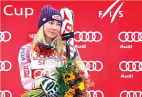  ??  ?? Mikaela Shiffrin, of the United States, looks towards her grandmothe­r Polly Condron in the audience after winning the women’s FIS Alpine Skiing World Cup slalom race Photo: AP