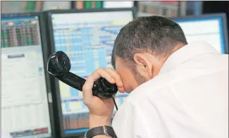  ?? REUTERS ?? A trader from BGC, a global brokerage company in London’s Canary Wharf financial centre, reacts during trading on Friday after Britain voted to leave the EU in the Brexit referendum.