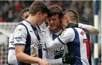  ?? ?? SWIFT RETRIBUTIO­N: Baggies celebrate the winner