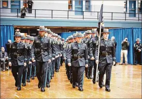  ?? Connecticu­t State Police / Contribute­d photo ?? The Connecticu­t State Police recently graduated 53 new state troopers, all members of the 131st Training Troop, at the Hartford Armory. Four are assigned to the Westbrook Troop F barracks. The latest subject of debate in Connecticu­t’s increasing­ly contentiou­s gubernator­ial election: a listicle from the website WalletHub.