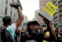  ?? PHOTO: AP ?? African National Congress members protest outside the party’s headquarte­rs in Johannesbu­rg, calling for President Jacob Zuma to step down.