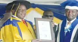  ??  ?? President Mnangagwa displays his honorary Doctor of Technology Degree ( Honoris Causa) awarded by Harare Institute of Technology while Vice Chancellor Engineer Quinton Kanhukamwe looks on at a graduation ceremony yesterday. (Picture by Kudakwashe Hunda) See stories on Page 2