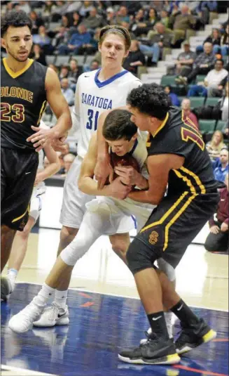  ?? STAN HUDY - SHUDY@DIGITALFIR­STMEIDA.COM ?? Colonie’s Aaron Satin (10) and Saratoga’s Aidan Holmes struggle over a loose ball in the lane as Isiash Moll (23) and Will Fox (31) look on at the Cool Insuring Arena duirng the Section II Class AA semifinal. Feb. 27, 2018.