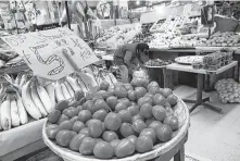  ?? Rebecca Blackwell / Associated Press ?? Mexican tomatoes are displayed for sale at a produce stand in Mercado Medellin in Mexico City.