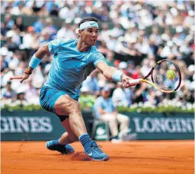  ?? REUTERS ?? To the fore . . . Spaniard Rafael Nadal plays a forehand in his thirdround match against Frenchman Richard Gasquet at the French Open in Paris yesterday. Nadal won 63, 62, 62.