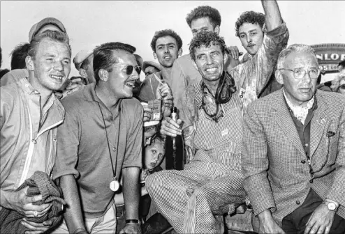  ?? Jacques Marqueton The Associated Press file ?? Fans surround driver Carroll Shelby after he and teammate Roy Salvadori, not shown, won the 24 Hours of Le Mans race in 1959 in Le Mans, France. Shelby and Salvadori drove their Aston Martin at an average speed of 112 mph.