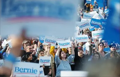  ?? Stephanie Strasburg/Post-Gazette ?? People react as Democratic presidenti­al candidate Sen. Bernie Sanders, I-Vt., talks to the crowd on April 14 at Schenley Plaza in Oakland.