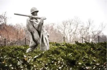  ?? DARREN S. HIGGINS PHOTOS/THE NEW YORK TIMES ?? The Korean War Veterans Memorial, on the western flank of the National Mall, features 19 statues of soldiers.